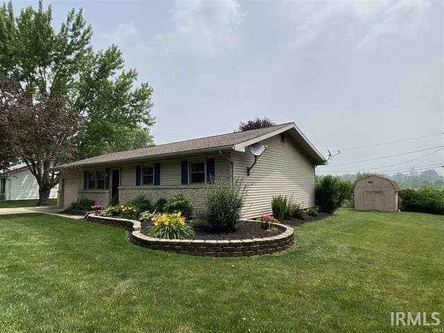 205 Holly Ln, Geneva, IN 46740 - ranch-style home with an attached garage, a front lawn, brick siding, and concrete driveway