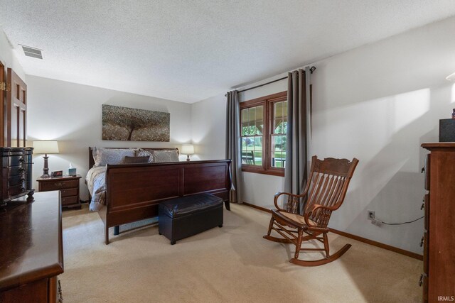103 Ironwood Ave, Kendallville, IN 46755 - bedroom with light colored carpet, a textured ceiling, and baseboards