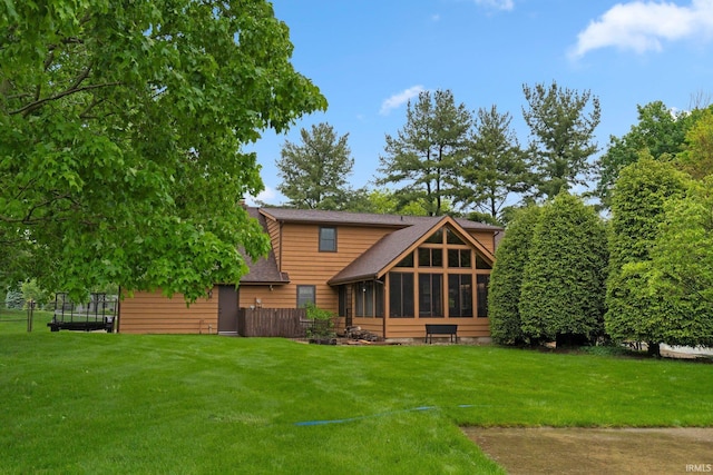 103 Ironwood Ave, Kendallville, IN 46755 - rear view of property with a sunroom and a shingled roof