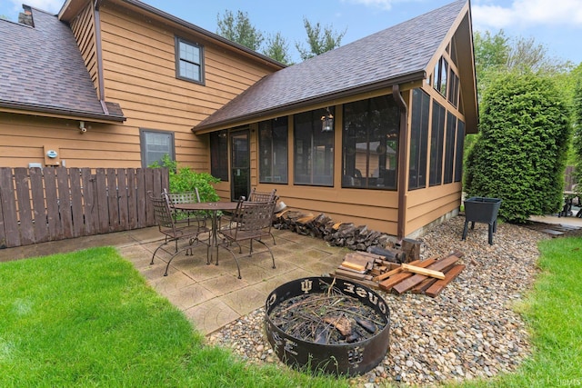 103 Ironwood Ave, Kendallville, IN 46755 - view of patio / terrace featuring an outdoor fire pit, a sunroom, and outdoor dining space