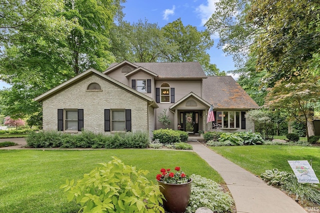 125 Durkees Run Dr, Lafayette, IN 47905 - traditional-style house with a front yard and brick siding
