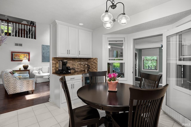 125 Durkees Run Dr, Lafayette, IN 47905 - dining area featuring light tile patterned floors and a chandelier