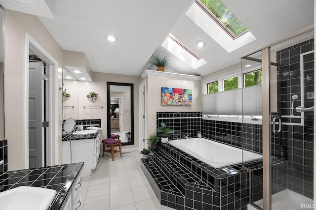125 Durkees Run Dr, Lafayette, IN 47905 - full bath featuring a skylight, vanity, a stall shower, a tub with jets, and tile patterned flooring