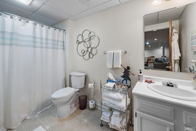125 Durkees Run Dr, Lafayette, IN 47905 - bathroom featuring tile patterned flooring, toilet, vanity, curtained shower, and a paneled ceiling
