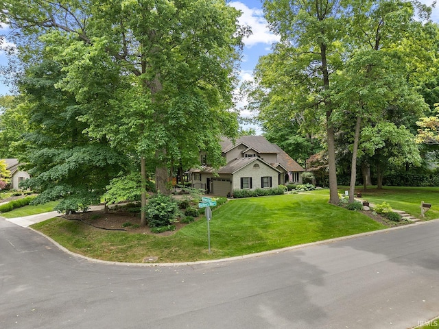 125 Durkees Run Dr, Lafayette, IN 47905 - view of property hidden behind natural elements featuring a front yard and a garage