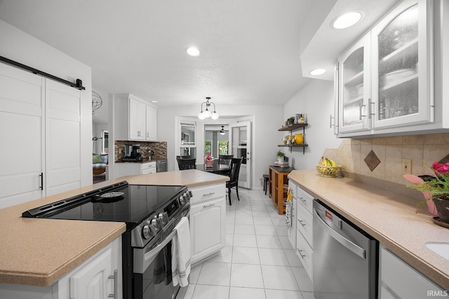 125 Durkees Run Dr, Lafayette, IN 47905 - kitchen with dishwasher, range with electric cooktop, a center island, white cabinets, and light tile patterned flooring