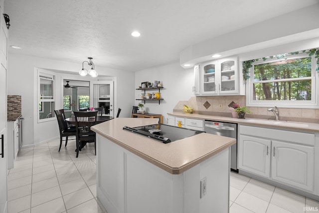 125 Durkees Run Dr, Lafayette, IN 47905 - kitchen with a sink, black electric stovetop, dishwasher, a kitchen island, and plenty of natural light