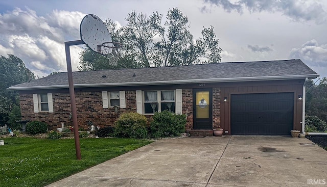 11239 Thomas Dr, Evansville, IN 47712 - ranch-style home featuring a front yard, an attached garage, concrete driveway, brick siding, and roof with shingles