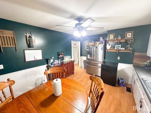 11239 Thomas Dr, Evansville, IN 47712 - dining room with ceiling fan and light wood-type flooring