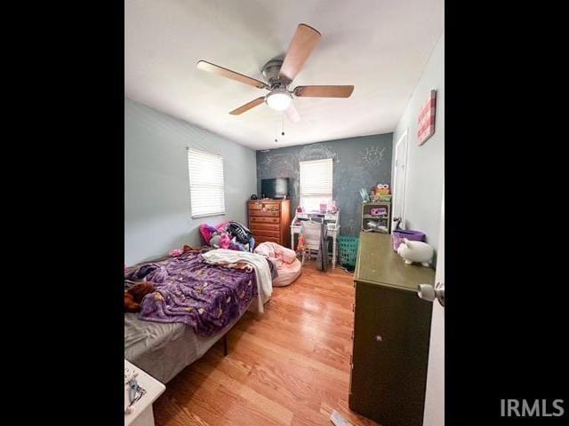 11239 Thomas Dr, Evansville, IN 47712 - bedroom featuring wood finished floors and a ceiling fan