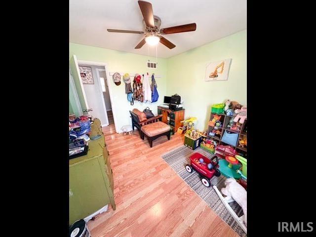 11239 Thomas Dr, Evansville, IN 47712 - rec room with ceiling fan and wood finished floors
