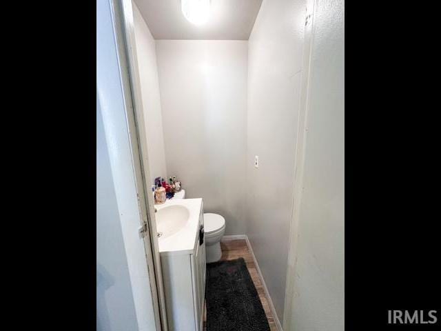 11239 Thomas Dr, Evansville, IN 47712 - bathroom featuring vanity, toilet, and baseboards