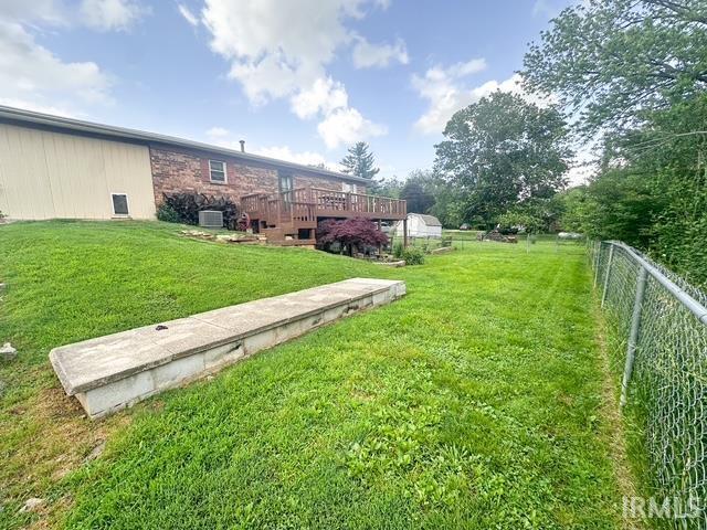11239 Thomas Dr, Evansville, IN 47712 - view of yard featuring a deck and central air condition unit