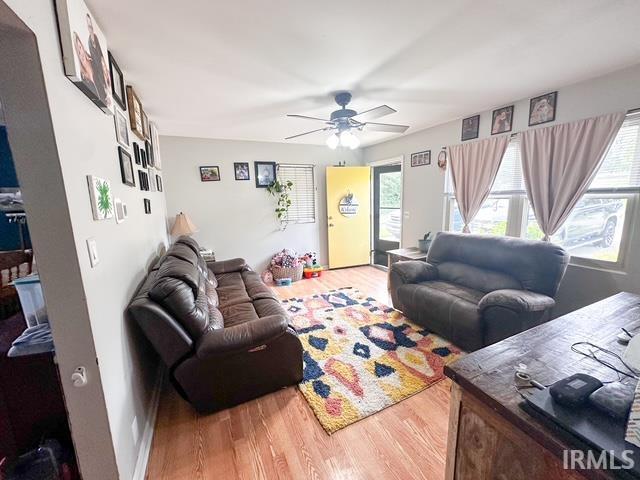 11239 Thomas Dr, Evansville, IN 47712 - living room with plenty of natural light, a ceiling fan, and wood finished floors