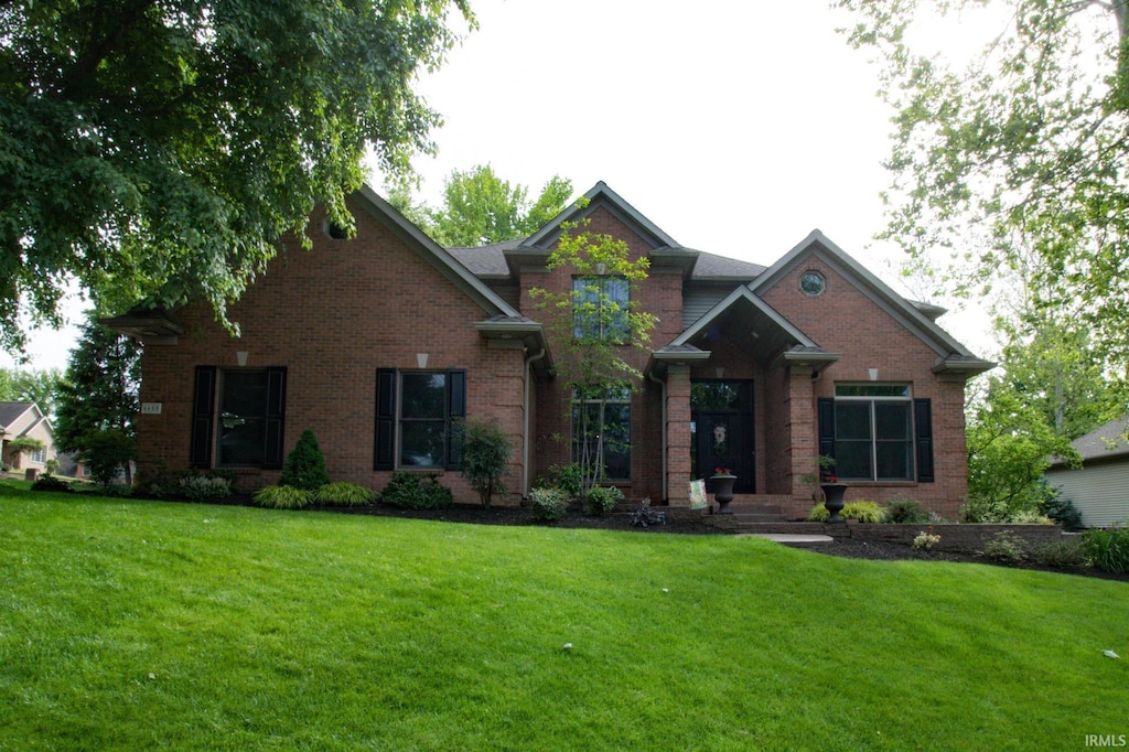 6655 River Ridge Drive, Newburgh, IN 47630 - view of front facade featuring a front yard and brick siding