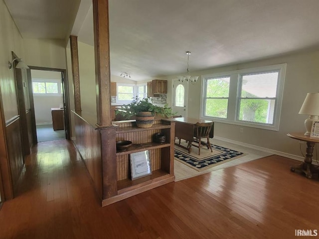 2347 E Navaho Dr, Vincennes, IN 47591 - dining area with wood-type flooring, a chandelier, and baseboards