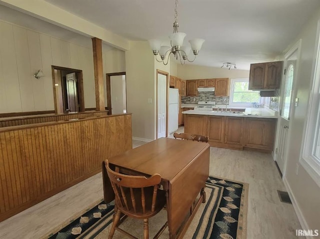 2347 E Navaho Dr, Vincennes, IN 47591 - dining area featuring light wood-style flooring, a chandelier, and baseboards