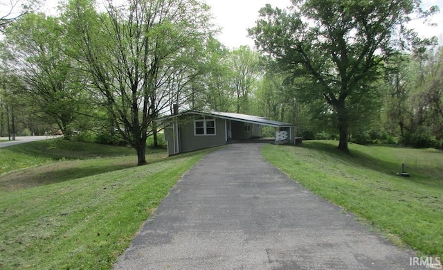 2347 E Navaho Dr, Vincennes, IN 47591 - view of front of home with asphalt driveway, a front yard, and an attached carport