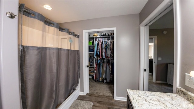 2014 Buell Dr, Angola, IN 46703 - full bathroom with a shower with curtain, vanity, wood finished floors, and baseboards