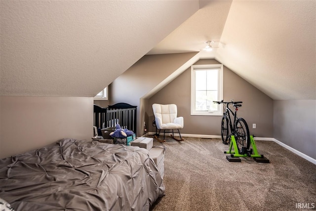 2014 Buell Dr, Angola, IN 46703 - bedroom with carpet flooring, lofted ceiling, a textured ceiling, and baseboards