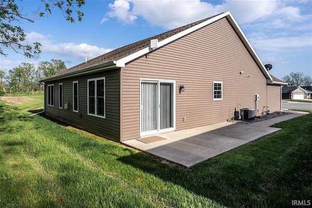 2014 Buell Dr, Angola, IN 46703 - back of house with a lawn and a patio