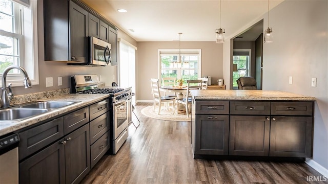 2014 Buell Dr, Angola, IN 46703 - kitchen with stainless steel appliances, a sink, dark wood-type flooring, light countertops, and recessed lighting