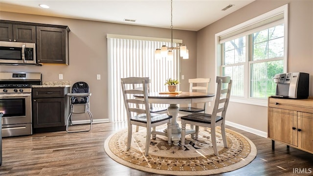 2014 Buell Dr, Angola, IN 46703 - dining space with a chandelier, wood finished floors, baseboards, and recessed lighting
