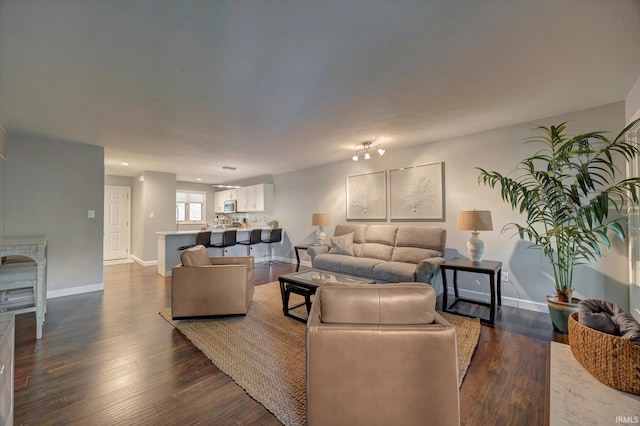 1881 E Eagle Bay Dr, Bloomington, IN 47401 - living area with baseboards and dark wood-style floors