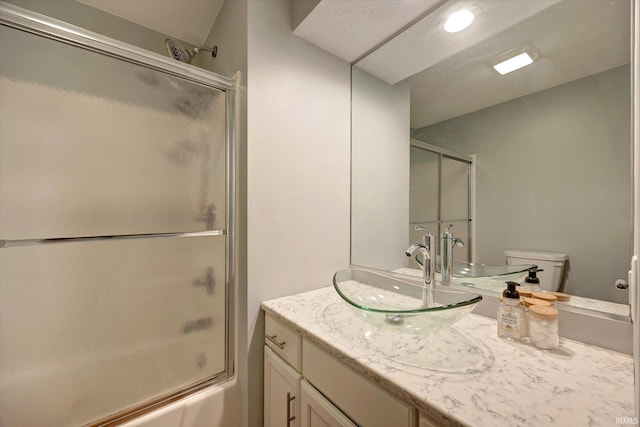 1881 E Eagle Bay Dr, Bloomington, IN 47401 - full bathroom featuring bath / shower combo with glass door, vanity, and toilet