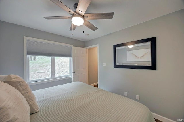 1881 E Eagle Bay Dr, Bloomington, IN 47401 - bedroom with baseboards and a ceiling fan