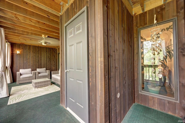 1881 E Eagle Bay Dr, Bloomington, IN 47401 - interior space with wood walls, carpet, and a chandelier