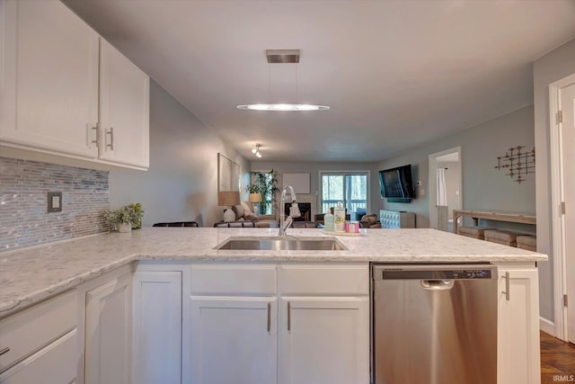 1881 E Eagle Bay Dr, Bloomington, IN 47401 - kitchen featuring dishwasher, a sink, open floor plan, white cabinets, and decorative backsplash
