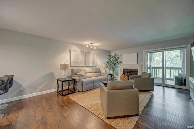 1881 E Eagle Bay Dr, Bloomington, IN 47401 - living room featuring a fireplace, hardwood / wood-style floors, and baseboards