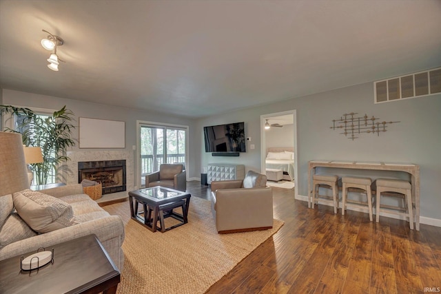 1881 E Eagle Bay Dr, Bloomington, IN 47401 - living room with wood finished floors, a fireplace, and baseboards