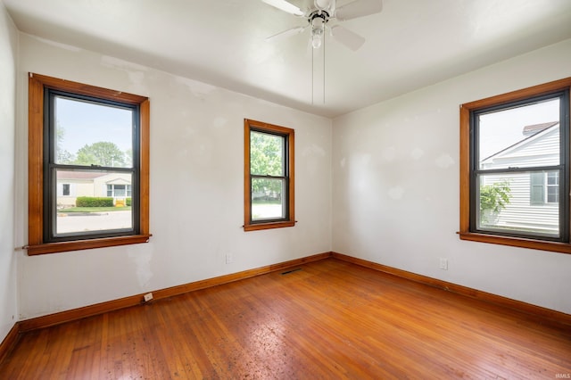 217 Vasbinder Dr, Anderson, IN 46017 - unfurnished room with hardwood / wood-style flooring, baseboards, and a ceiling fan