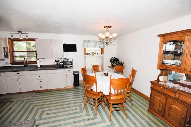 328 N Harding Ave, Mishawaka, IN 46544 - dining area featuring a chandelier and baseboards