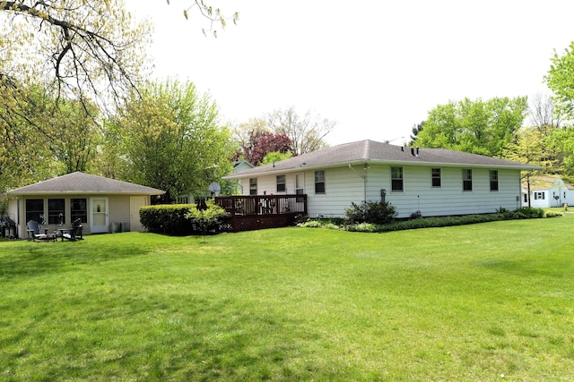 328 N Harding Ave, Mishawaka, IN 46544 - back of house featuring a wooden deck and a yard