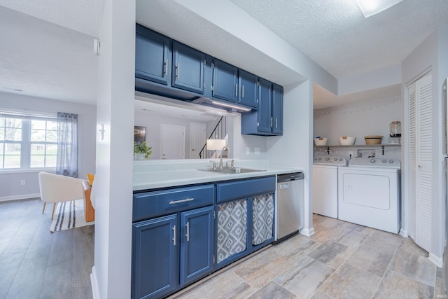 3417 S Westminster Way, Bloomington, IN 47401 - kitchen with blue cabinetry, a sink, stainless steel dishwasher, light countertops, and independent washer and dryer