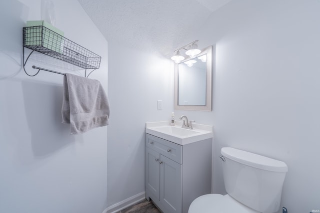 3417 S Westminster Way, Bloomington, IN 47401 - half bath featuring vanity, toilet, and a textured ceiling