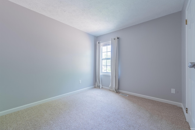 3417 S Westminster Way, Bloomington, IN 47401 - unfurnished room featuring carpet floors, baseboards, and a textured ceiling