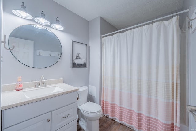 3417 S Westminster Way, Bloomington, IN 47401 - full bathroom with wood finished floors, vanity, toilet, and curtained shower