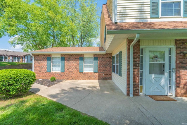 3417 S Westminster Way, Bloomington, IN 47401 - view of home's exterior with brick siding and roof with shingles