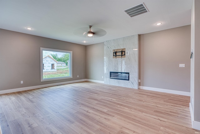 3605 Sand Dr, Newburgh, IN 47630 - unfurnished living room featuring ceiling fan, baseboards, light wood finished floors, a fireplace, and recessed lighting