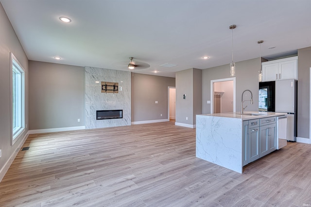 3605 Sand Dr, Newburgh, IN 47630 - kitchen featuring a sink, baseboards, light wood finished floors, ceiling fan, and recessed lighting