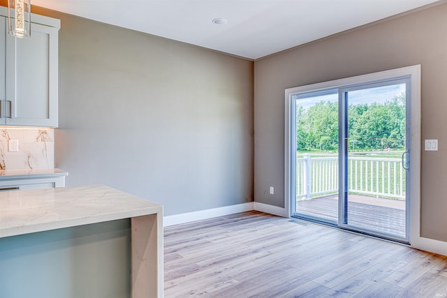3605 Sand Dr, Newburgh, IN 47630 - unfurnished dining area featuring light wood-style floors and baseboards