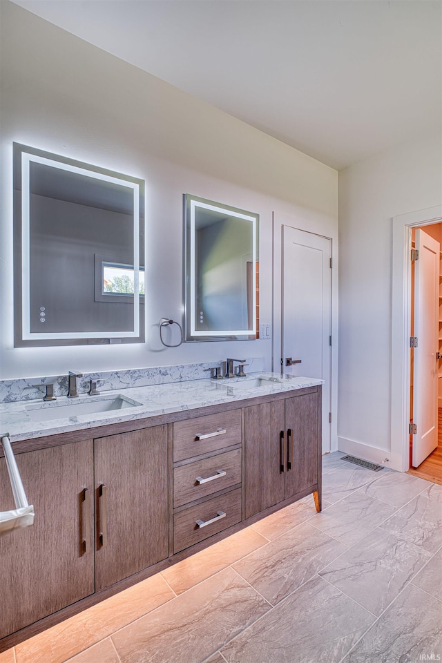 3605 Sand Dr, Newburgh, IN 47630 - bathroom with double vanity and baseboards