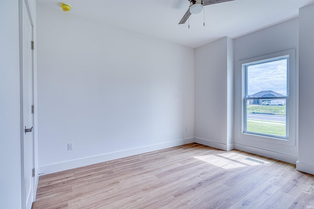 3605 Sand Dr, Newburgh, IN 47630 - unfurnished room with plenty of natural light, light wood-style floors, ceiling fan, and baseboards
