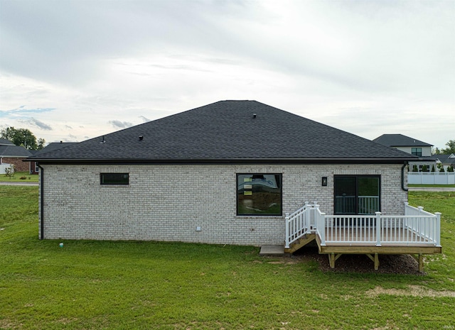 3605 Sand Dr, Newburgh, IN 47630 - back of property featuring a wooden deck, a shingled roof, a yard, and brick siding