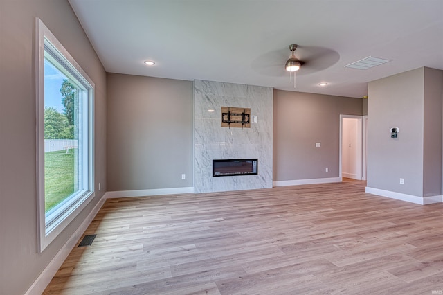 3605 Sand Dr, Newburgh, IN 47630 - unfurnished living room with ceiling fan, baseboards, healthy amount of natural light, a large fireplace, and recessed lighting