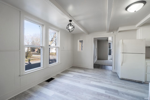 1437 Oakland St, Fort Wayne, IN 46808 - unfurnished dining area featuring beamed ceiling and light wood-type flooring
